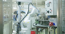 Robot working in a production line of parts for the automotive industry