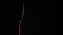 Religious Incense Stick With Smoke Burning On Black Background In The Temple