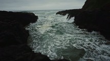 a churning sea in an inlet 