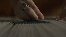 woman weaving on a loom closeup 