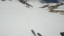 Freeride Skiing down a chute in winter Alps mountains backcountry, adrenaline adventure freedom, action head camera view
