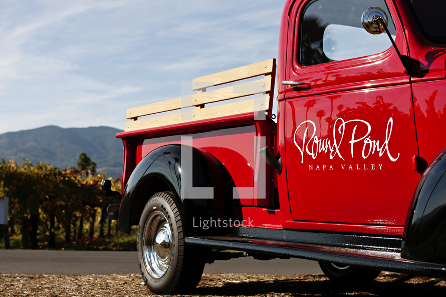Old classic Truck parked at vineyard red