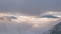 Window view between clouds sky in beautiful misty mountain nature time lapse

