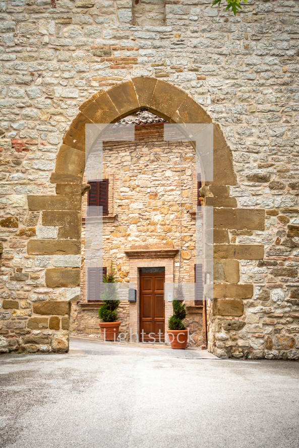 old arched stone entrance in Italy 