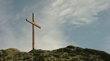 a cross at the top of a mountain 