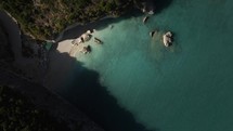 Sandy beach with turquoise water, aerial drone view