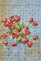 overhead view of red tulips in a vase 