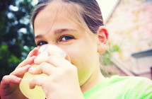 little girl drinking lemonade 