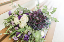 purple and white flowers in a bridal bouquet 