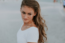 a woman walking on a beach 