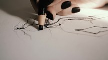 a woman sketching fashion 