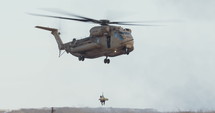 Military transport helicopter during an army rescue operation