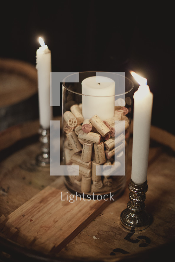 Unity candle set on top of wine corks