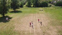 kids playing soccer on a field 