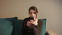 Girl Browsing Internet On Mobile Phone - Close Up Shot	