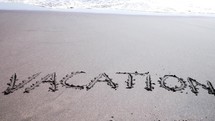 Word Vacation Is Washed Away By Sea Or Ocean Wave. Beautiful Nature Background
