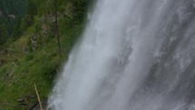 Slow motion of water falling down in Stuibenfall waterfall in Tirol alps nature
