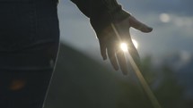 hand touching sunlight 