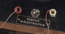 Macro shot of antique electrical switchboard with switches, lights and knobs