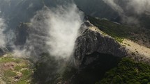Dramatic cloud above a rocky mountain in Madeira Portugal aerial view during summer