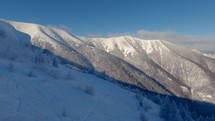Panorama of frozen snowy alps mountains in backcountry ski resort off piste freeride zone
