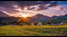 Beautiful sunset sky in rural countryside nature with sheep graze in peaceful evening landscape time lapse
