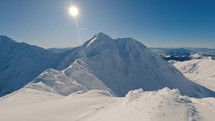Panorama of Winter Alps mountains in frozen sunny nature
