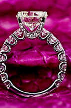 A diamond ring on a pink leather large diamond solitaire 