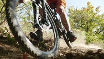 man riding a bicycle on a dirt trial 