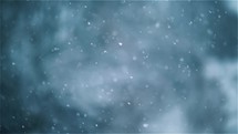 Slow motion of snow falling over winter background.
