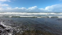 Ocean waves moving in sunny summer coast 
