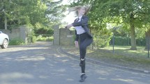 Senior school girl practising ballet on the way to school themes of ballet carefree routines education 