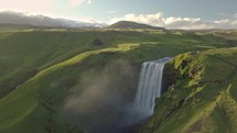 Aerial view of Skogafos waterfall during sunny evening in Iceland.