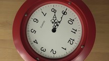 A quirky spinning clock face with stationary hands