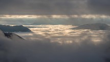 Mystic mountains nature landscape view between clouds sky at sunrise Time-lapse
