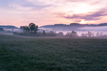 morning mist over a lake at sunrise 