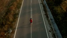 man jogging on a road 