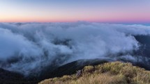 Peaceful evening colors in mountains nature above clouds time lapse
