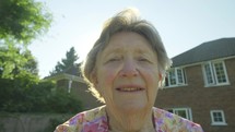 face of an senior caucasian woman outdoors 