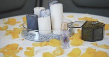 candles and perfume on a table 