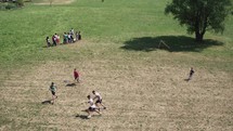 boys playing soccer in a field 