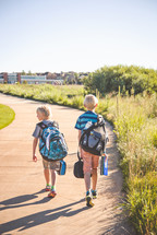 two boys walking to school 