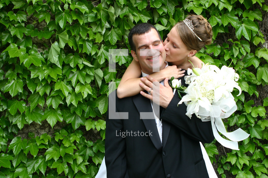 bride kissing broom