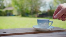 tea cup on a bench 
