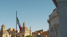 Italian flag waving in the sky of Rome