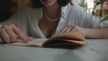 Young Woman reading a book