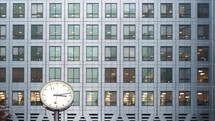 clock and view inside of Office building windows - editorial use only 