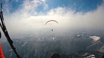 Paragliding in the clouds.
