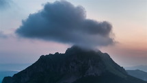  Time lapse of clouds over the mountains before sunrise
