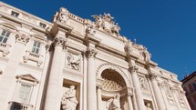 Historical statues and building at Trevi Fountain